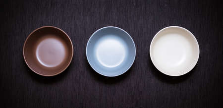Tree empty bowl on black backgroundの写真素材