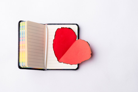 red heart on the notebookの写真素材