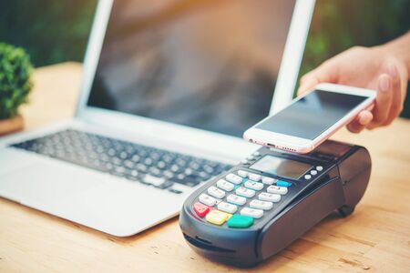 Woman using mobile paymentの写真素材