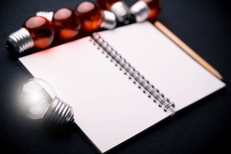 book and light bulb, business education concept.の写真素材