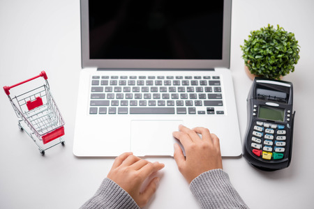 Online shopping concept. laptop or smartphone with cart