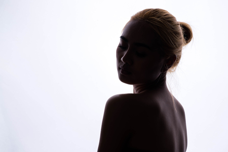 silhouette of beautiful young womanの写真素材