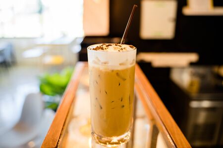 Closeup a glass of iced cappucinoの写真素材