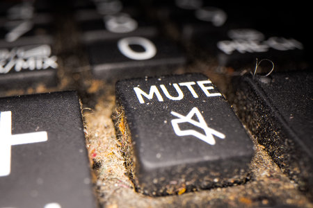 dust, lint and debris between the keys of an old keyboardの写真素材