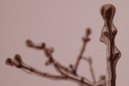ice-covered branches with buds as if in a crystal shell from rain and frost in pastel colors
