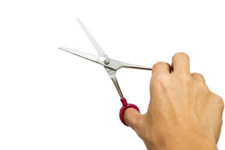 A salon scissors in hand grip.