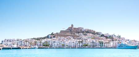 Beautiful light of the sun over the city of Ibiza in pamorma format