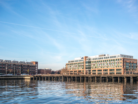 Baltimore, USA - December 27, 2014 - View of the Bond Street Wharf from the coast on a sunny winter...