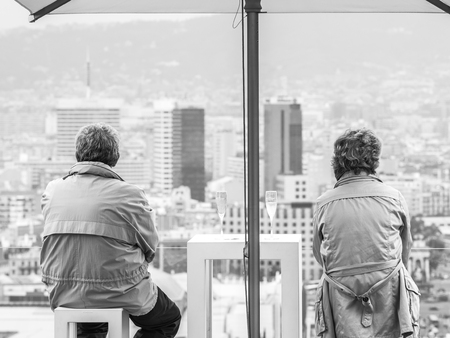 BARCELONA, SPAIN - OCTOBER 18, 2015. A couple of tourists in the rooftop of the Palau Nacional...