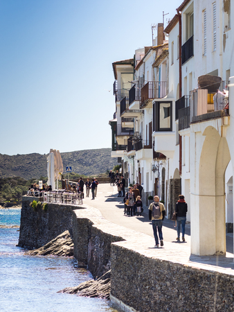 Cadaques, Spain - April 9, 2016: Street along the water and houses of the village of Cadaques, Spain.のeditorial素材