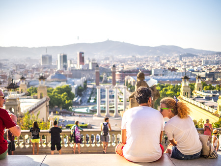 A couple of tourists enjoying the views of Barcelona in a summer evening.のeditorial素材