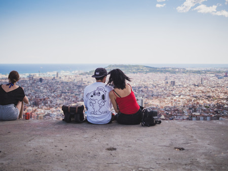 Barcelona, Spain - September 10, 2017: View of a couple watching the city of Barcelona from the Carmel's bunkersのeditorial素材
