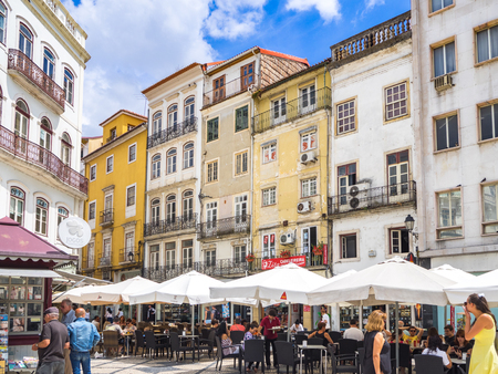 Coimbra, Portugal - July 10, 2017: View of the restaurants and life in the Largo de Portagem square...