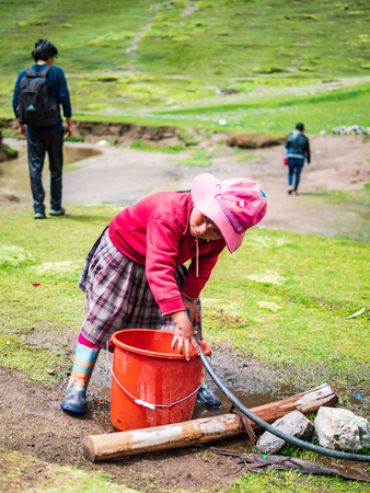 Vinicunca, Peru - January 7, 2017. View of a girl working for tourists in the Vinicunca mountain (Rainbow mountain)のeditorial素材