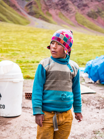 Vinicunca, Peru - January 7, 2017. View of a Boy working for tourists in the Vinicunca mountain (Rainbow mountain)のeditorial素材