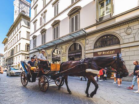 Firenze, Italy - May 29, 2017 - Tourists riding in a carriage around Firenze downtownのeditorial素材