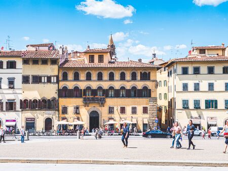 Firenze, Italy - May 27, 2017 - View of the buildings and tourists walking by the Piazza Pitti