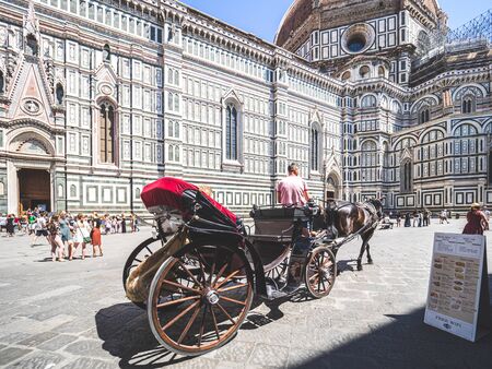 Firenze, Italy - May 29, 2017 - Tourists riding in a carriage around Santa Marie del Fioreのeditorial素材