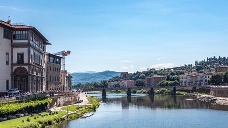 View of the Firenze's Ponte Santa Trinita bridge seen from the Ponte Vecchio in a sunny morningのeditorial素材