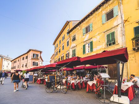Pisa, Italy - May 28, 2017 - Tourists in restaurants and walking near the Leaning tower of Pisaのeditorial素材