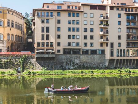 Firenze, Italy - May 27, 2017 - View of tourists in a boat in front of the Ponte Vecchioのeditorial素材