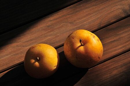 Pears on wooden floorの写真素材