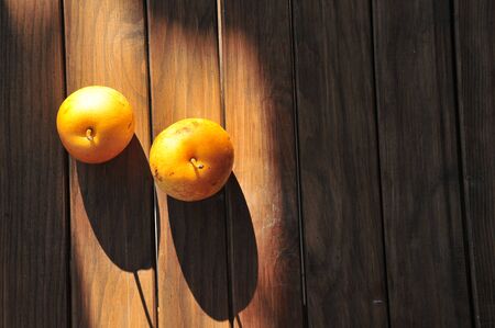 Two pears on wooden floorの写真素材