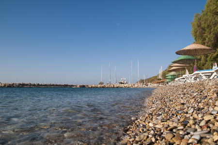 Beach and wicker beach umbrellasの写真素材