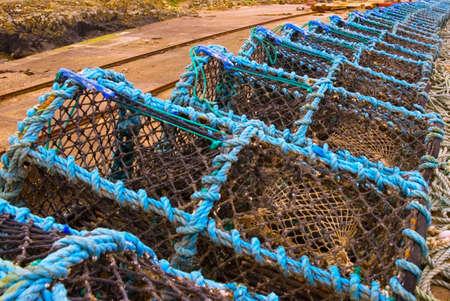 Blue lobster pots on harbour sideの写真素材