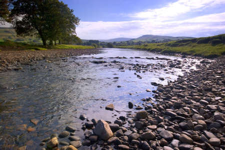 The River Ure near Hawes, Yorkshire Dales National Park, United Kingdom on a summer's dayの写真素材