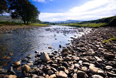 The River Ure near Hawes, Yorkshire Dales National Park, United Kingdom on a summer's dayの写真素材