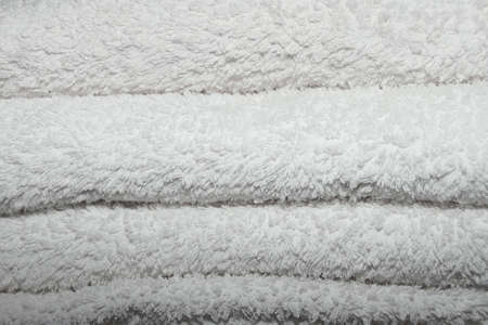 White flufy towels stacked togetherの写真素材