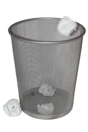 Paper being thrown into a rubbish bin. isolated on whiteの写真素材