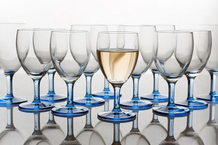 Glasses, one Full of Wineの写真素材