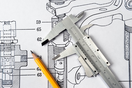 Old Caliper And Yellow Pencil On Mechanical Drawingの写真素材