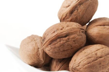 Walnuts Closeup in High Key on White Plate