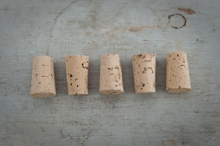 Still life photo od cork stoppers on a wooden boardの写真素材