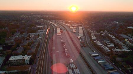 Sun coming up over Atlanta trainyardのeditorial素材
