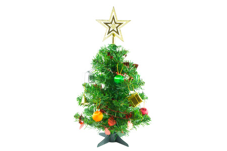 Christmas tree is ornamented with gold and silver gift box, heart red ribbon, orange and green Christmas ball, bell and gold star on white background の写真素材