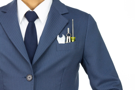 Businessman in Blue Suit with Wrench and Dividers and Screwdriver in Pocket Isolated on White Background. Concept about Technique or Mechanic or Repairing or Maintenance.の写真素材