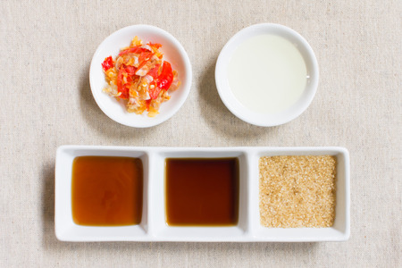 Ingredient or seasoning of Thai food. Soy and oyster and vegetable oil and Granulated brown sugar and chili and garlic.の写真素材