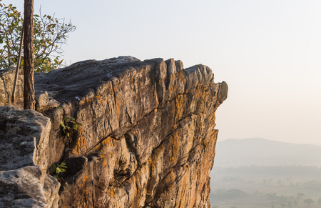 Pha Hua Rue Rock Cliff Mountain Hill Phayao Attractions Thailand with Warm Sun Light and Green Tree Landscape Left Zoom. Natural stone or rock mountain hill at Phayao northern Thailand travelの写真素材