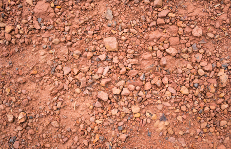Red Brown Gravel or Soil Texture Background for Design. Real gravel texture background and small stone on groundの写真素材