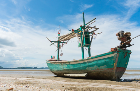 Green Fishing Boat or Fisherman Boat or Ship and blue sky and mountain or hill at Sam Roi Yod Beach Prachuap Khiri Khan Thailand. Landscape 
or scenery for summer season conceptの写真素材