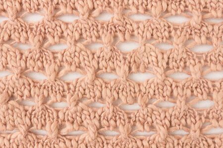 Brown Knitting Pattern or Knitted Pattern Background in macro style. Knitting Pattern or Knitted Pattern in vintage style for designの写真素材