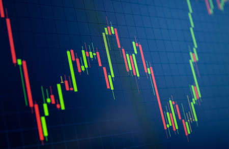 Tilted Red and Green Stock Chart or Forex Chart and Table Line on Black Backgroundの写真素材
