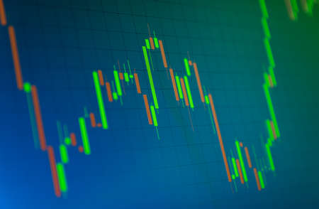 Tilted Red and Green Stock Chart or Forex Chart and Table Line on Blue Background in Green Toneの写真素材