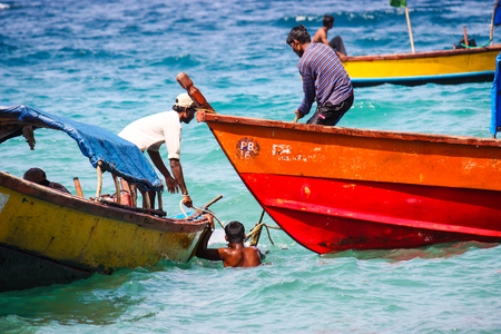 January 2, 2010: Indian fishermen on their boats in the oceanのeditorial素材