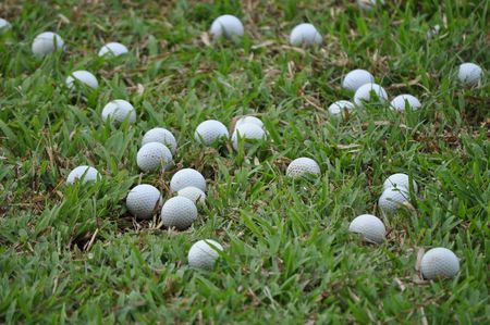 Metrogate Silang Estates, Silang, Cavite - September 18, 2010: a number of golf balls scattered at the field of the mini-golf course.のeditorial素材