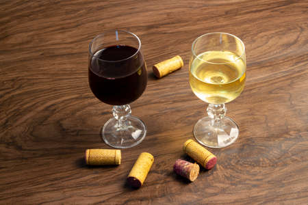 two glasses of wine on the table, red wine and white wine ..の写真素材
